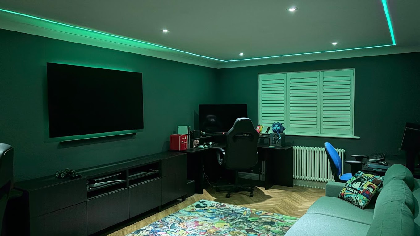 Gaming room with green LED coving and downlights