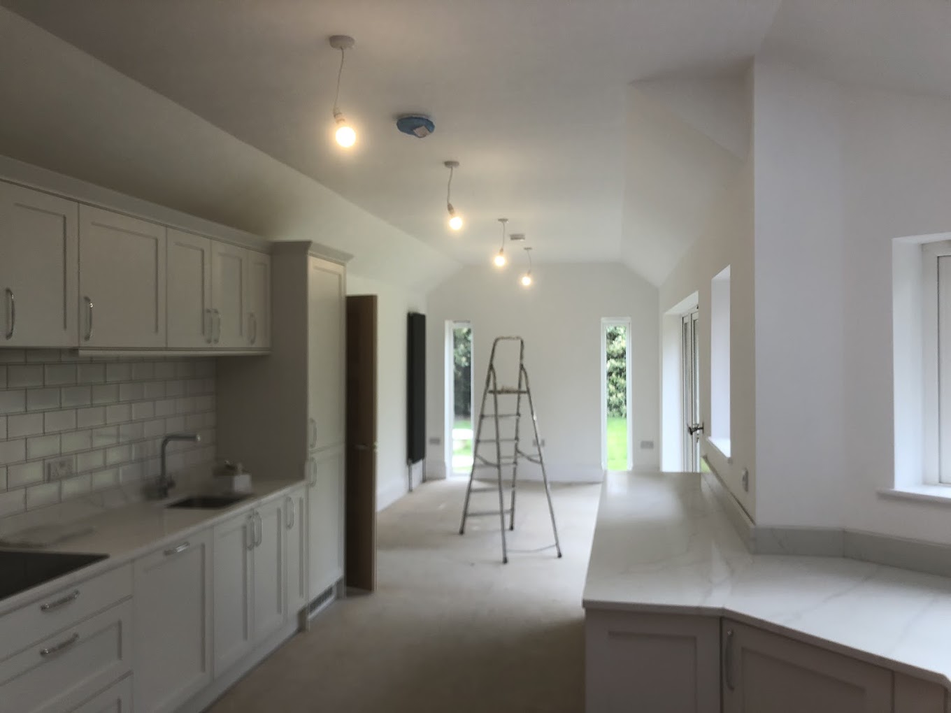 Kitchen pendant lighting installation in progress