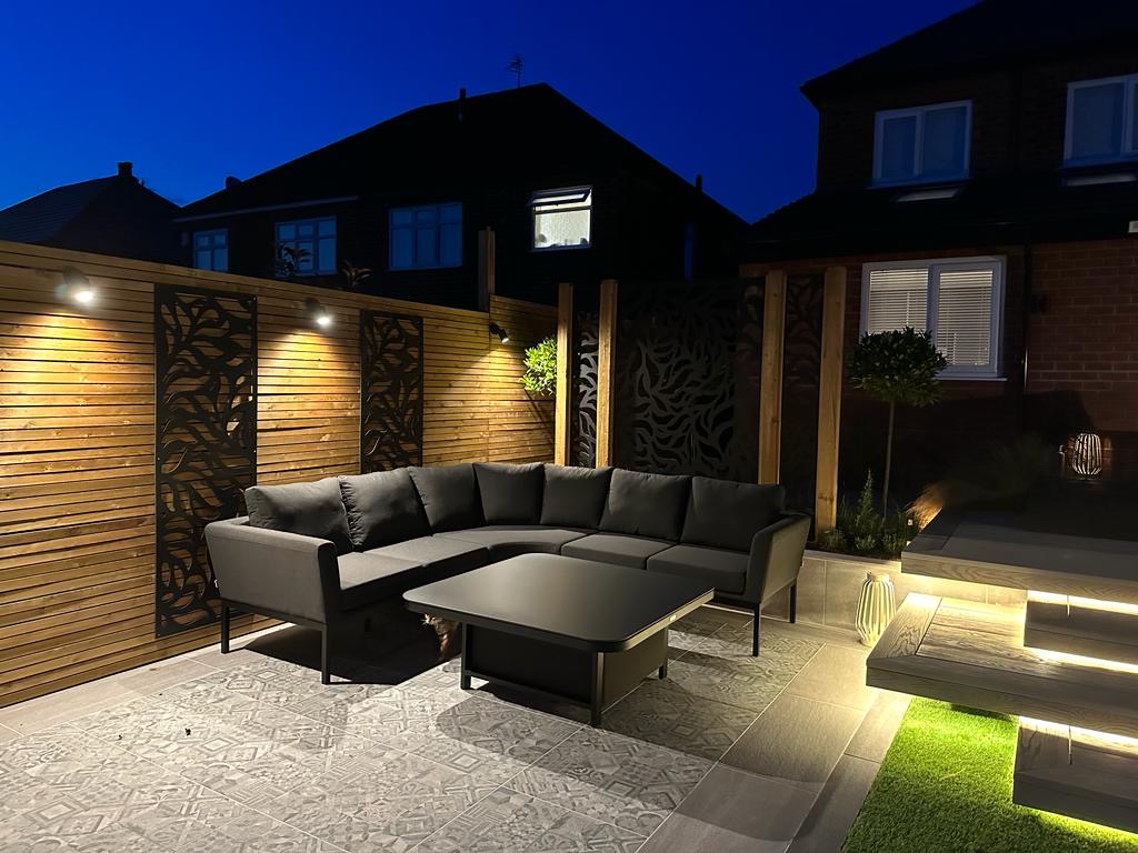 Garden patio lounge with wall lights and LED step lighting