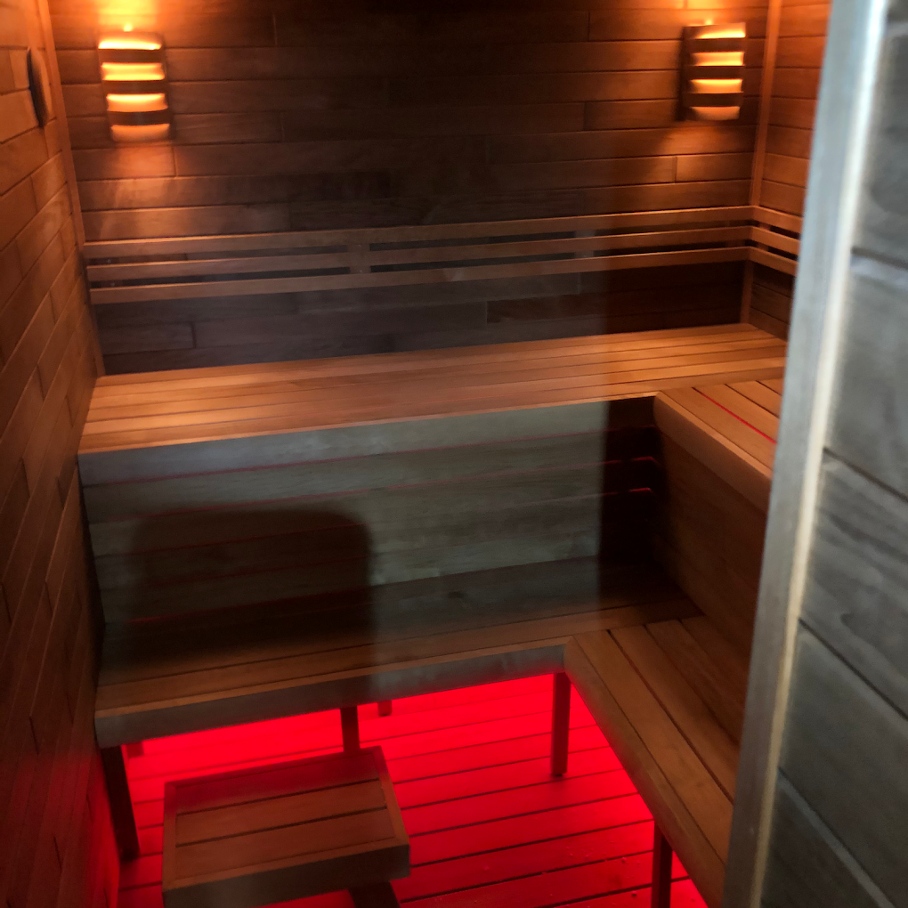 Sauna with red LED floor accent lighting